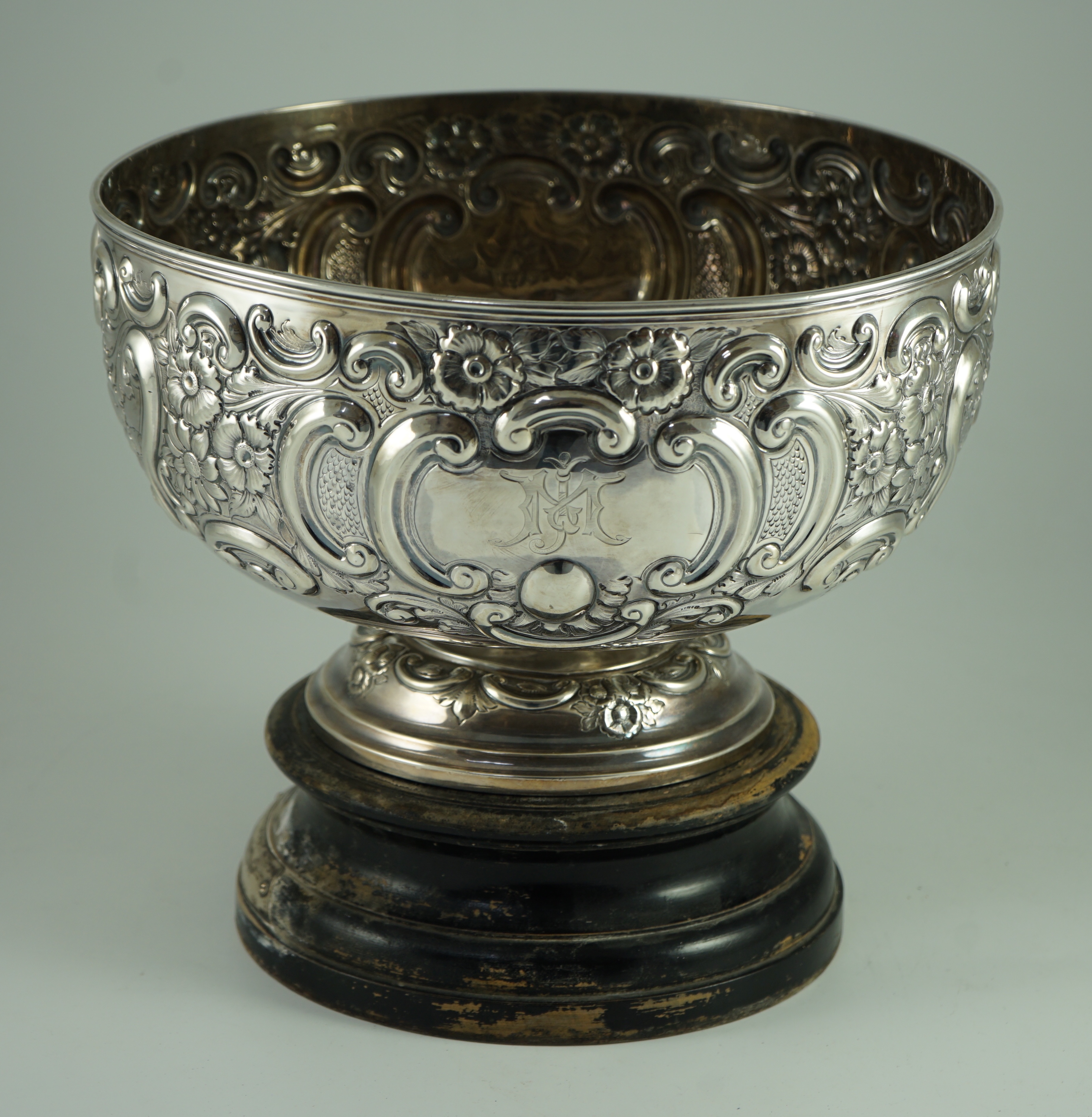 A late Victorian embossed silver pedestal punch bowl by Mappin Brothers (a.f.)